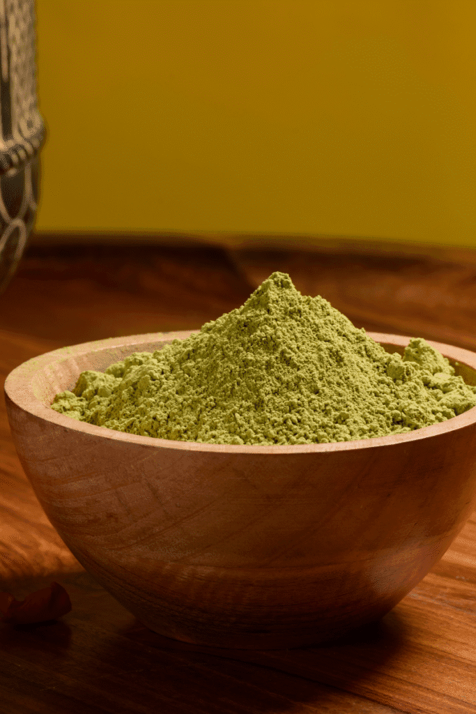 Woman applying neem face pack to treat acne and pimples naturally