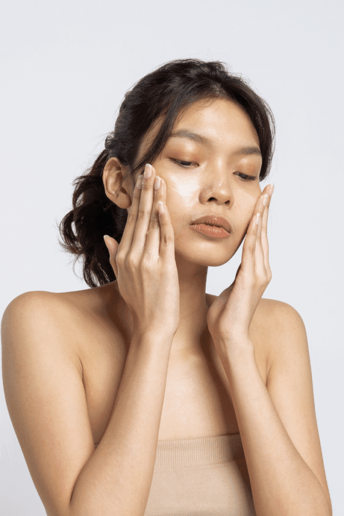 Applying clove and tea tree spot treatment on acne-prone skin | skincaresolutions.in