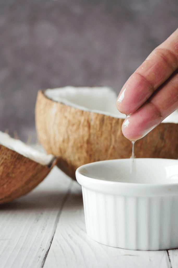 "Pouring cold-pressed almond oil into melted butters for added skin hydration | skincaresolutions.in