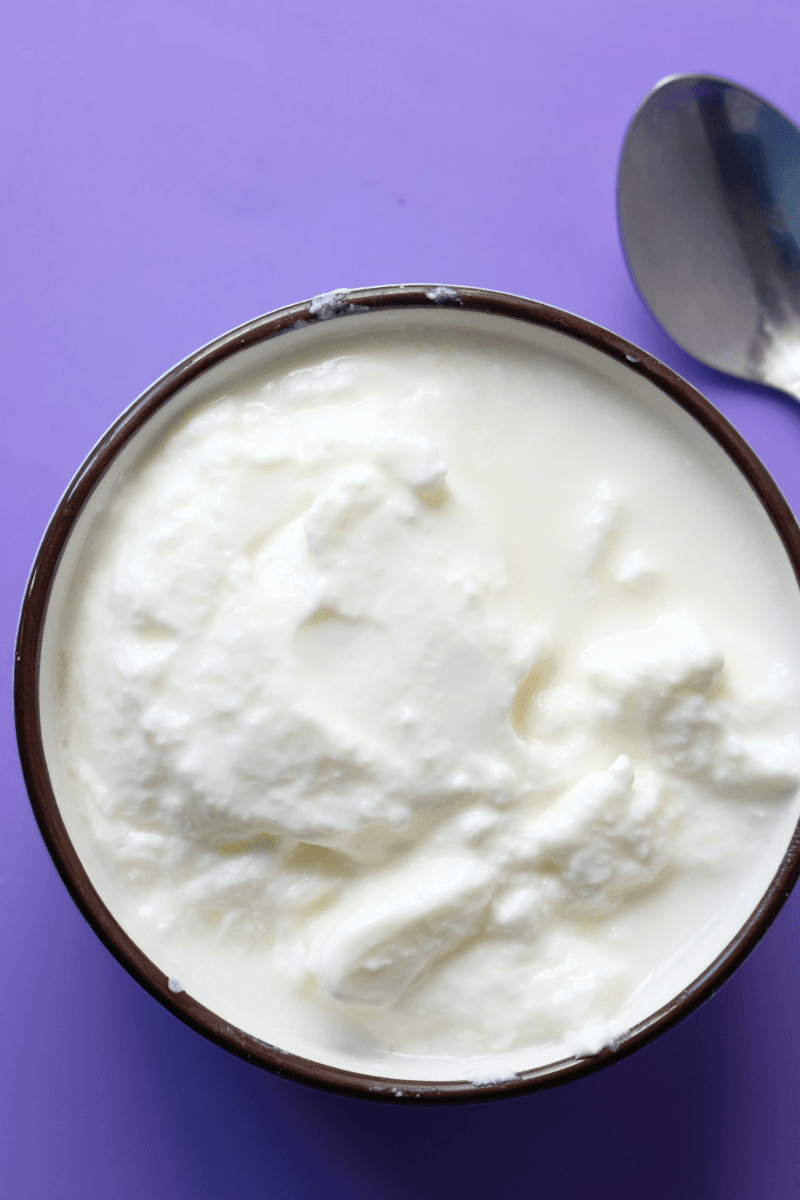 Fresh curd in a wooden bowl used in DIY skincare for soft, glowing skin | skincaresolutions.in