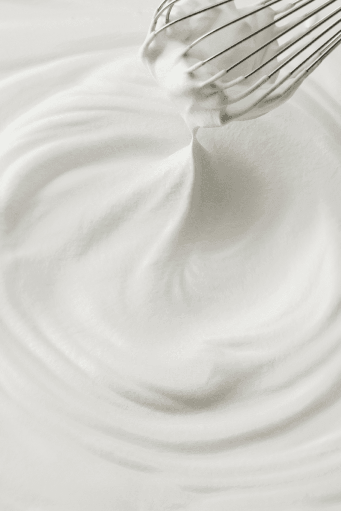 Whipping the cooled butter mixture until light and fluffy using a hand blender | skincaresolutions.in