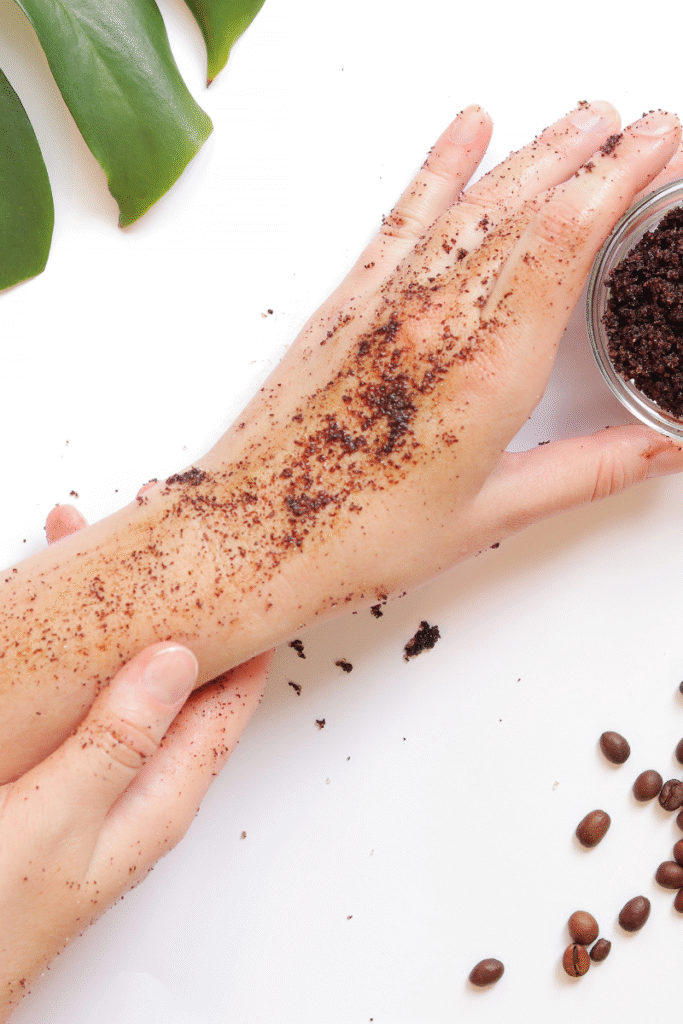 Applying DIY body polishing scrub at home on damp skin